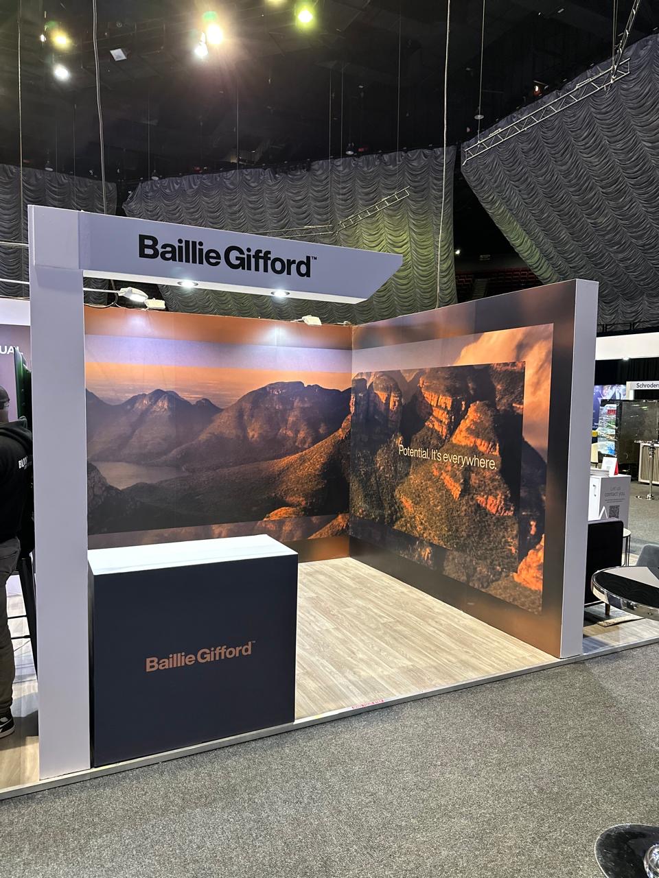 Custom exhibition stand built for Baillie Gifford, with large-format landscape photography panels